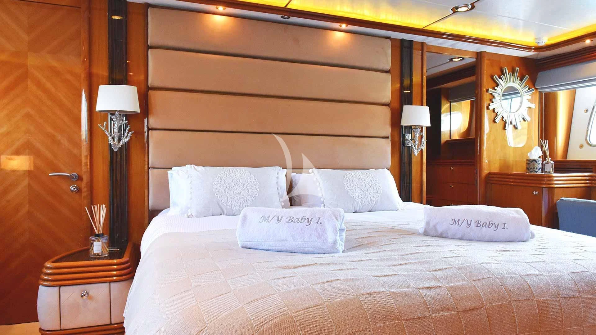 a bed with white pillows aboard BABY I Yacht for Sale