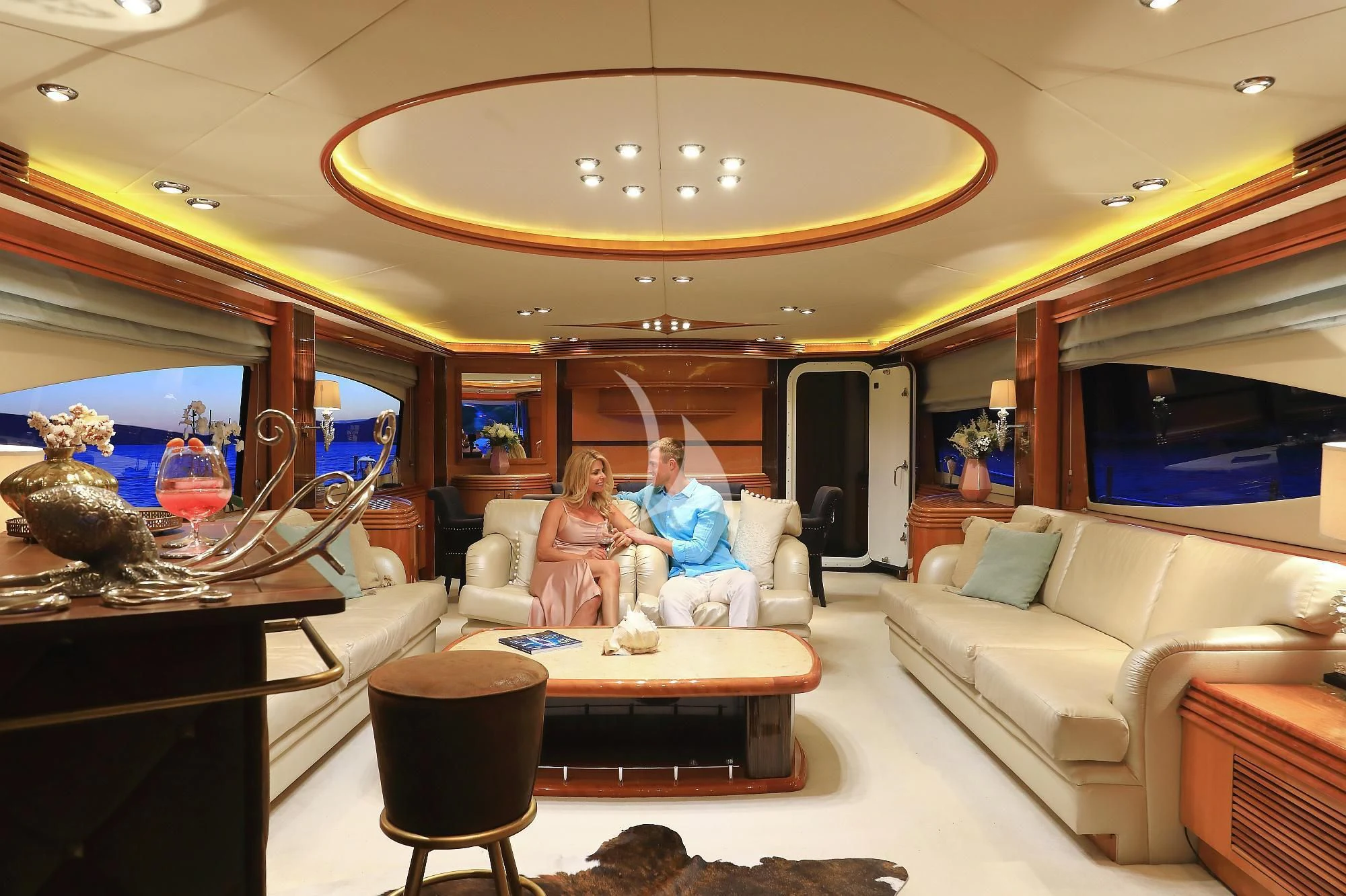 a group of people sitting in a living room aboard BABY I Yacht for Sale
