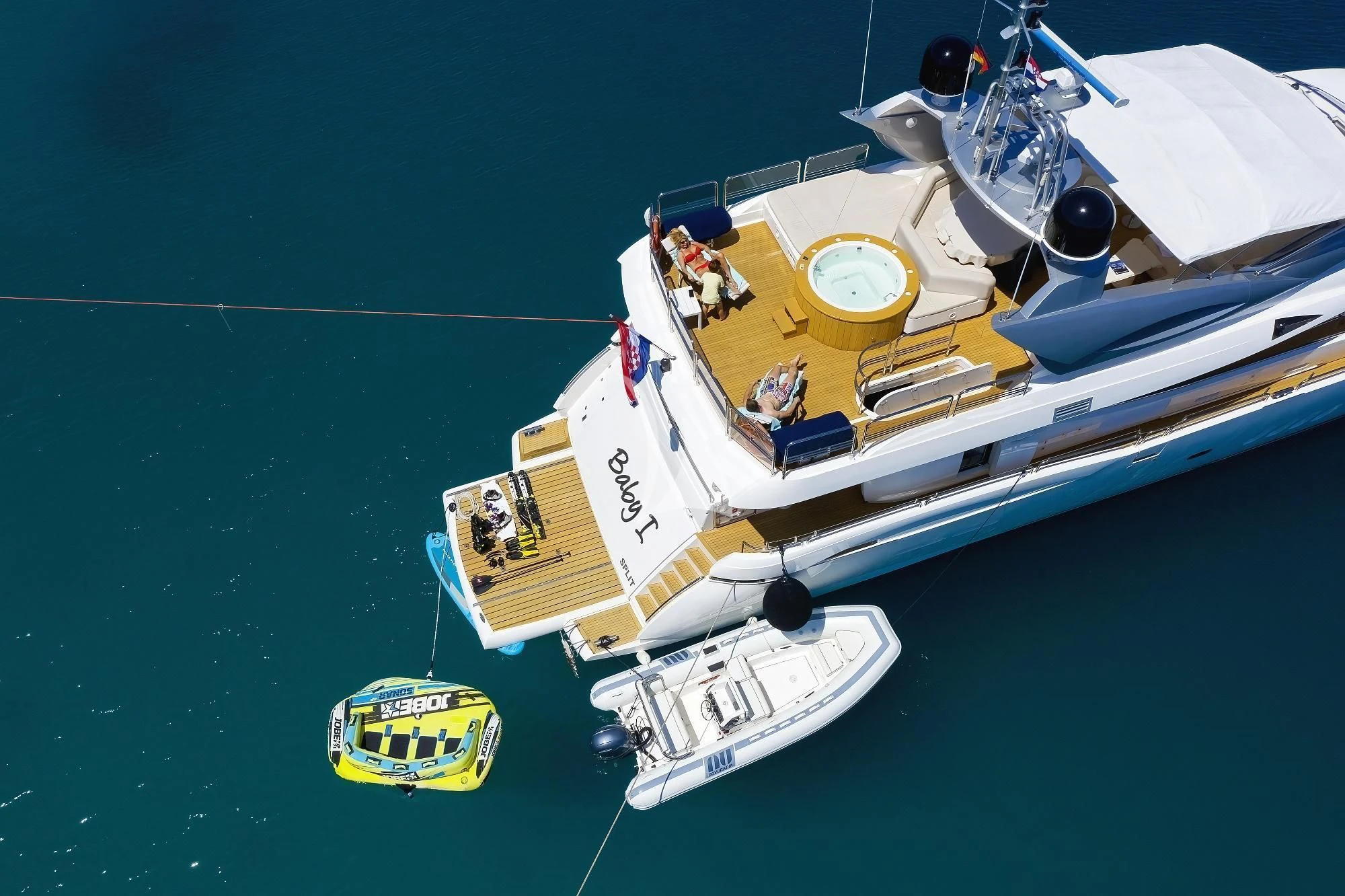 a boat with a yellow front aboard BABY I Yacht for Sale