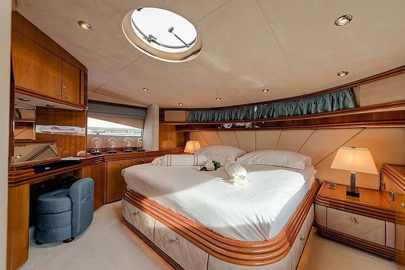 a bedroom with a large bed aboard BABY I Yacht for Sale