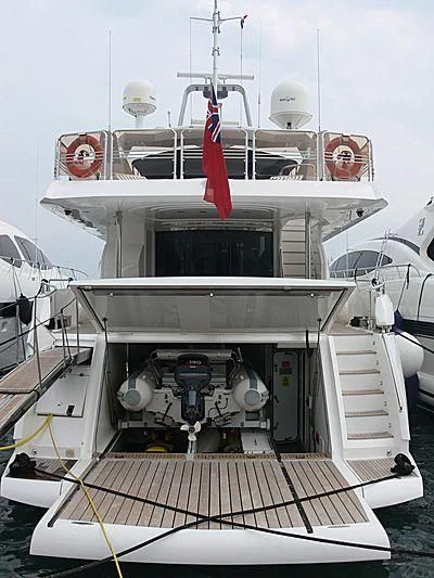 a large white boat with a red stripe on the front aboard BABY I Yacht for Sale