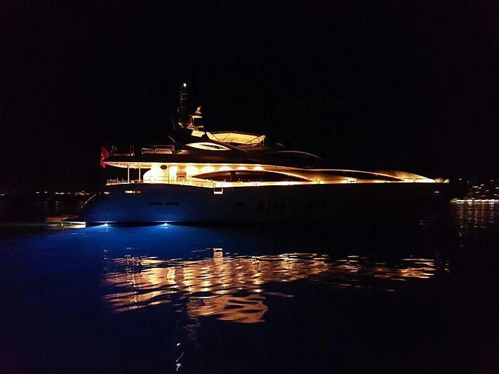 a large boat at night aboard BABY I Yacht for Sale
