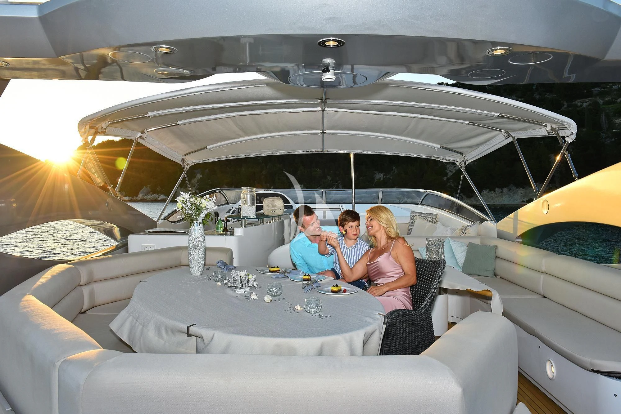 a group of people sitting in a tent aboard BABY I Yacht for Sale