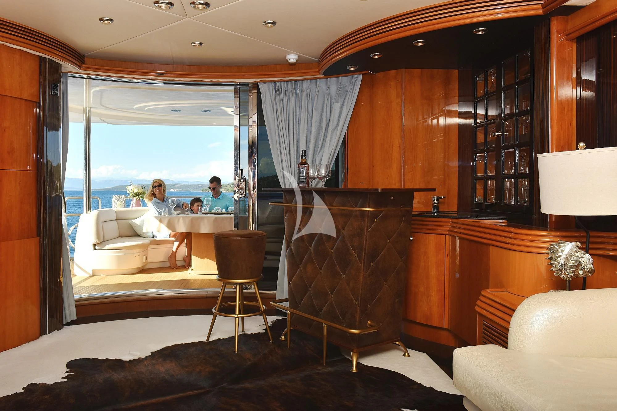 a living room with a fireplace aboard BABY I Yacht for Sale