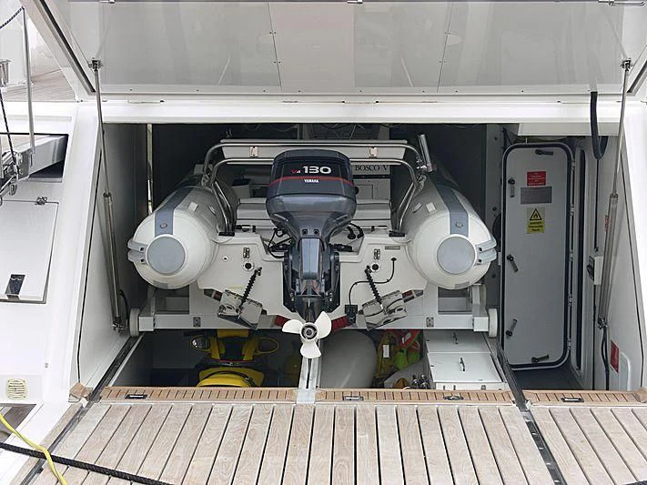 a large machine with a large black object on the side aboard BABY I Yacht for Sale