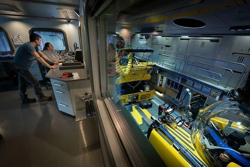 a few men working in a factory aboard OCEANXPLORER 1 Yacht for Sale