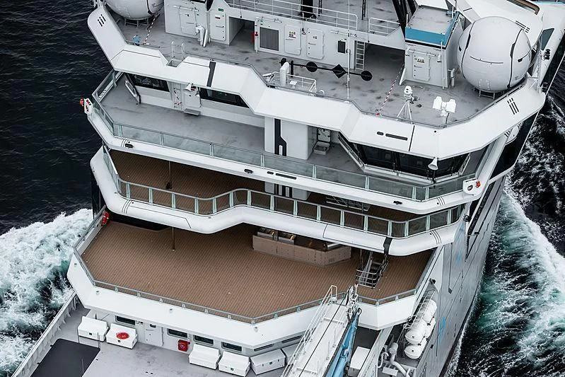 a large cruise ship docked aboard OCEANXPLORER 1 Yacht for Sale
