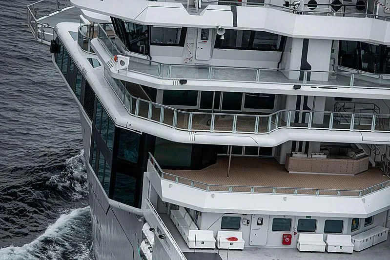 a large white boat with a balcony aboard OCEANXPLORER 1 Yacht for Sale