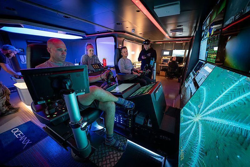 a group of people in a control room aboard OCEANXPLORER 1 Yacht for Sale