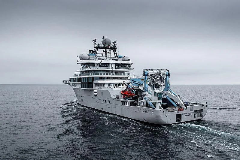 a large ship in the water aboard OCEANXPLORER 1 Yacht for Sale