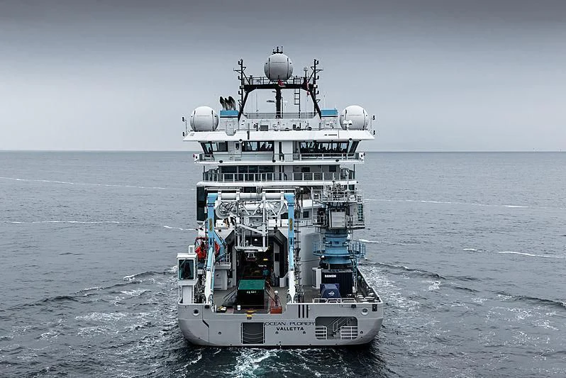a large ship in the water aboard OCEANXPLORER 1 Yacht for Sale