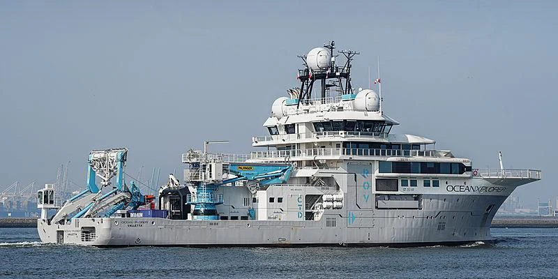 a large ship in the water aboard OCEANXPLORER 1 Yacht for Sale