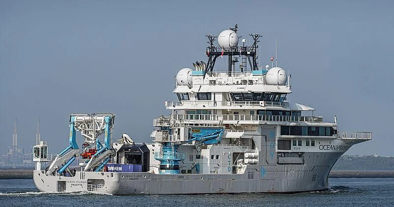 a large ship in the water aboard OCEANXPLORER 1 Yacht for Sale