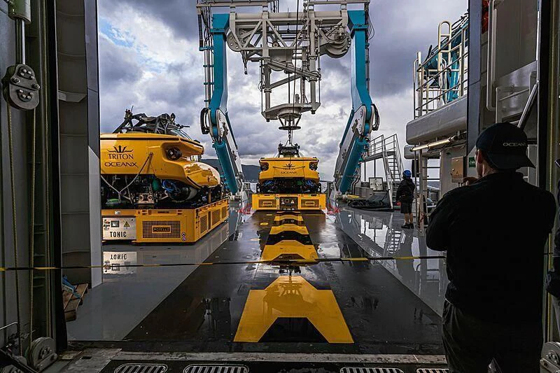 a yellow truck on a road aboard OCEANXPLORER 1 Yacht for Sale