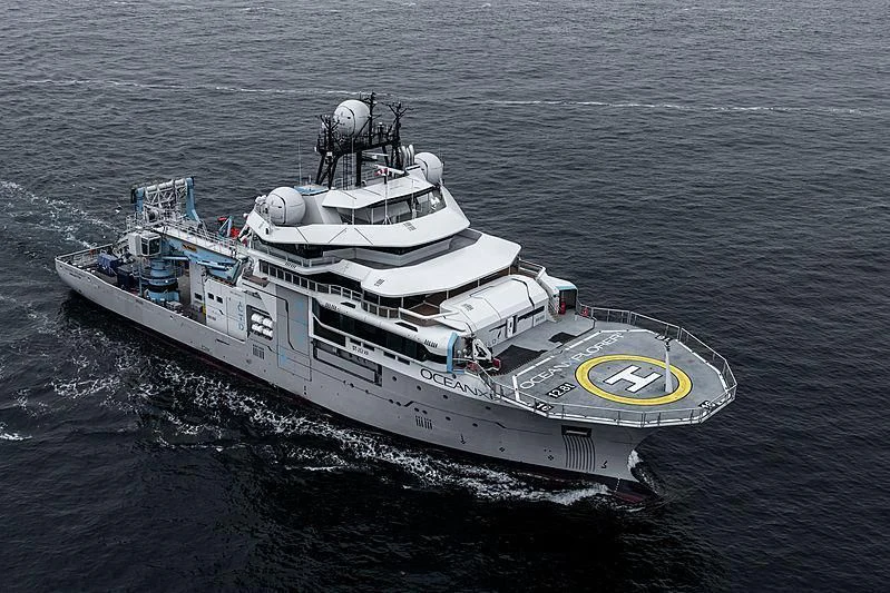 a large ship in the water aboard OCEANXPLORER 1 Yacht for Sale