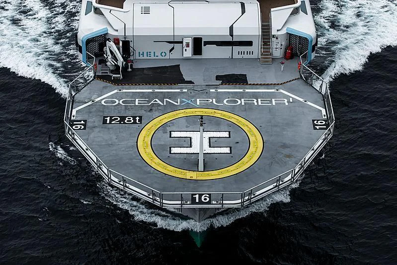 a large ship in the water aboard OCEANXPLORER 1 Yacht for Sale