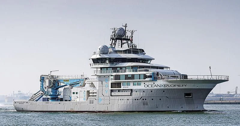 a large ship in the water aboard OCEANXPLORER 1 Yacht for Sale