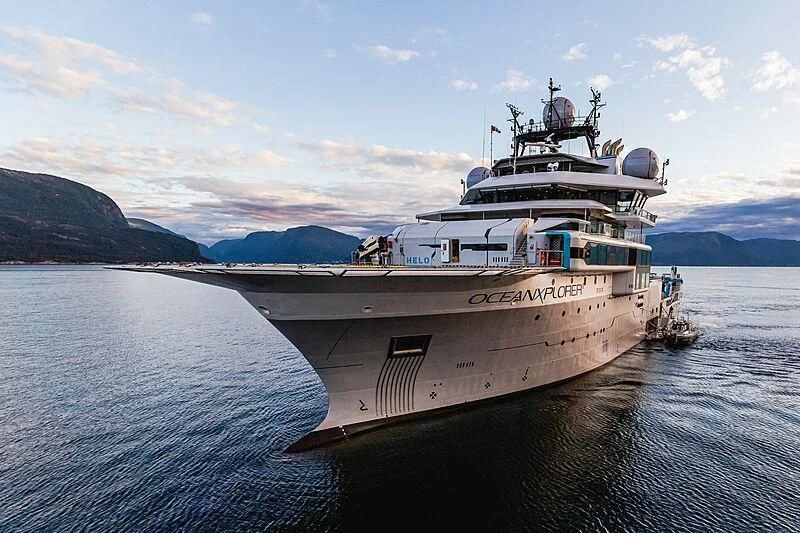 a large ship in the water aboard OCEANXPLORER 1 Yacht for Sale