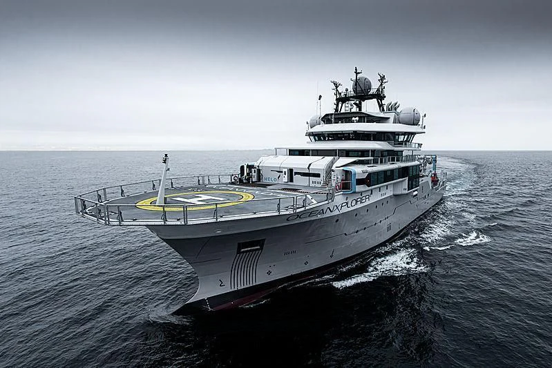 a large ship in the water aboard OCEANXPLORER 1 Yacht for Sale
