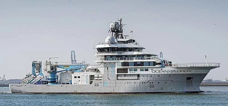 a large ship in the water aboard OCEANXPLORER 1 Yacht for Sale