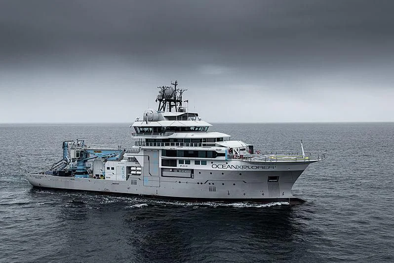 a large ship in the water aboard OCEANXPLORER 1 Yacht for Sale