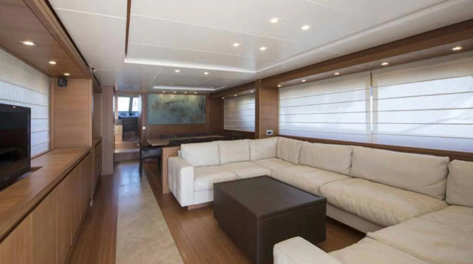 a living room with a couch and a tv aboard MARIS STELLA Yacht for Sale