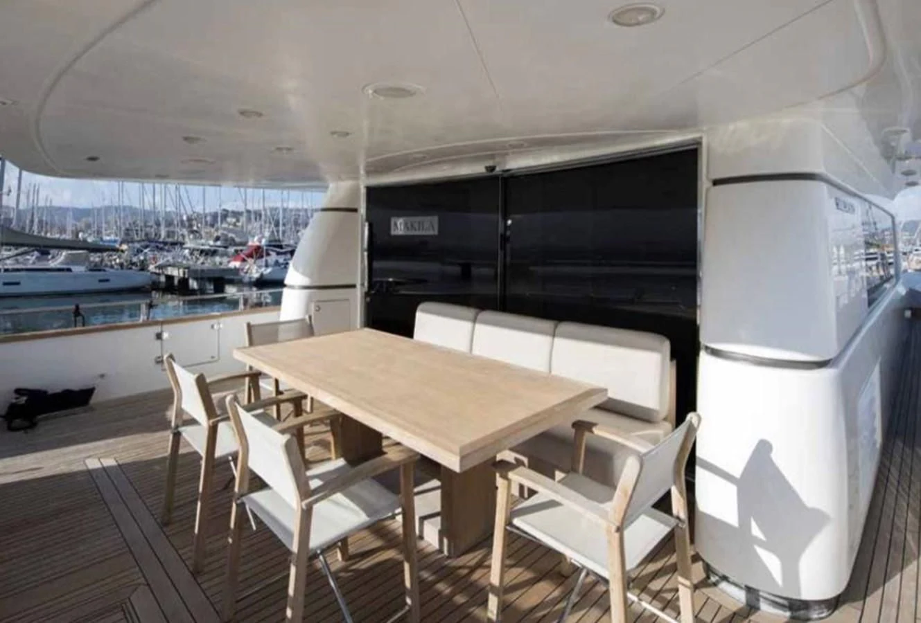 a table and chairs in a room aboard MARIS STELLA Yacht for Sale