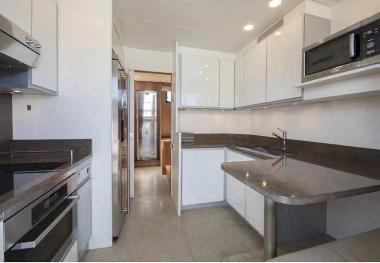 a kitchen with white cabinets aboard MARIS STELLA Yacht for Sale