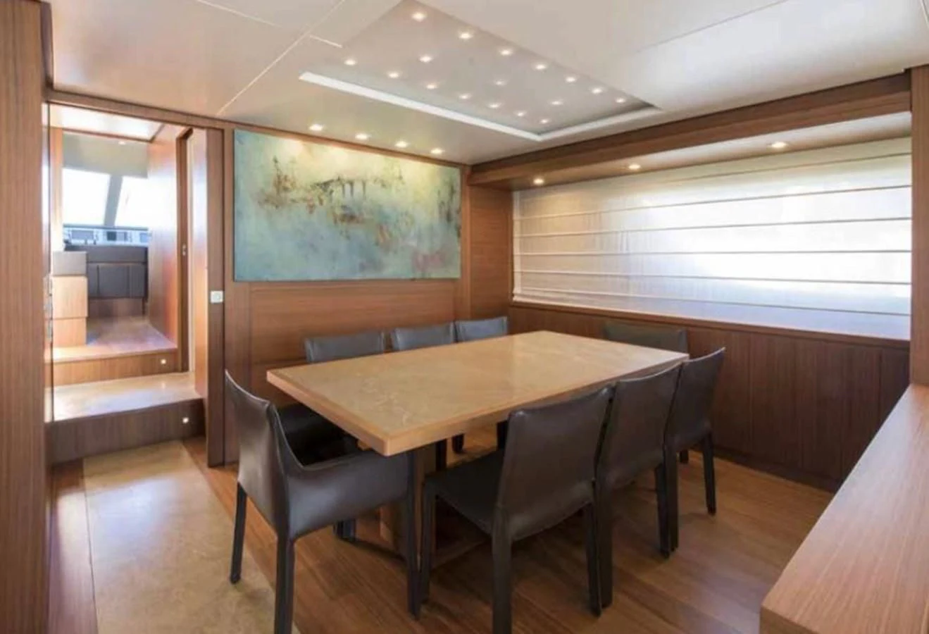 a table and chairs in a room aboard MARIS STELLA Yacht for Sale