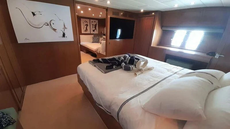 a room with a bed and a desk aboard PALOMA Yacht for Sale