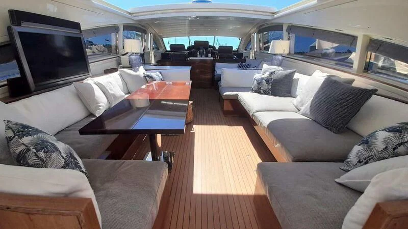 a room with a couch and a television aboard PALOMA Yacht for Sale