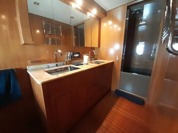 a bathroom with a sink and a mirror aboard PALOMA Yacht for Sale