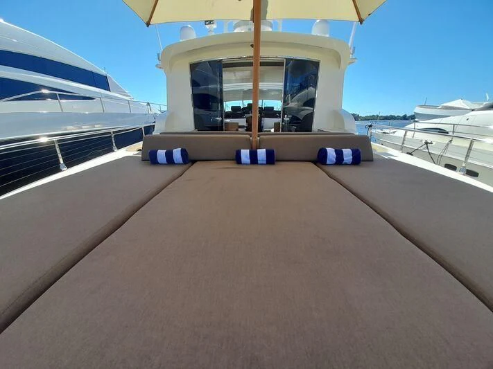 a building with a deck and a pool aboard PALOMA Yacht for Sale