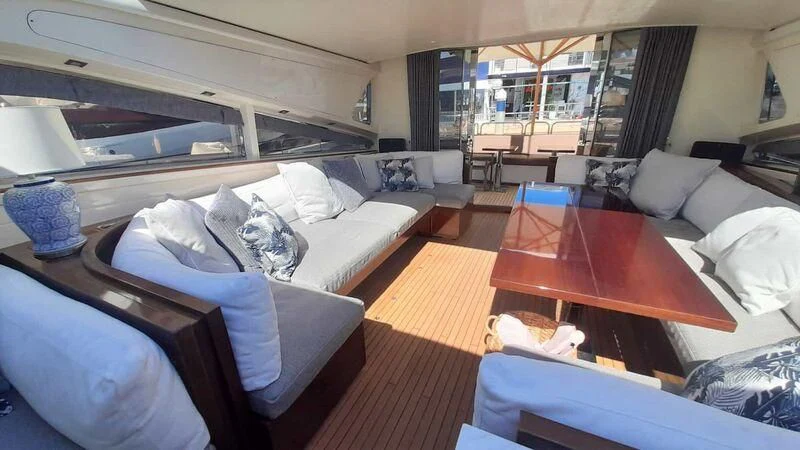 a room with a bed and a table aboard PALOMA Yacht for Sale