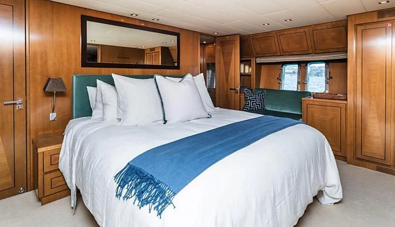 a bed in a room aboard PALOMA Yacht for Sale