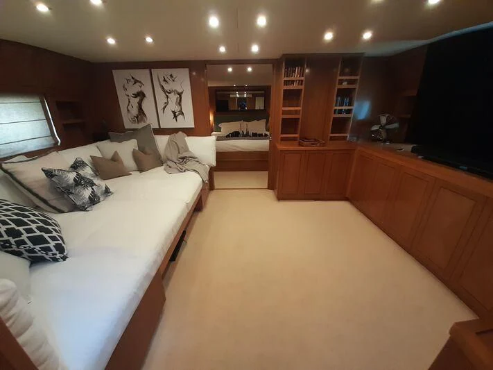 a room with a bed and a tv aboard PALOMA Yacht for Sale