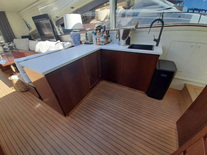 a kitchen with a wood floor aboard PALOMA Yacht for Sale