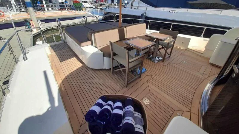 a room with tables and chairs aboard PALOMA Yacht for Sale