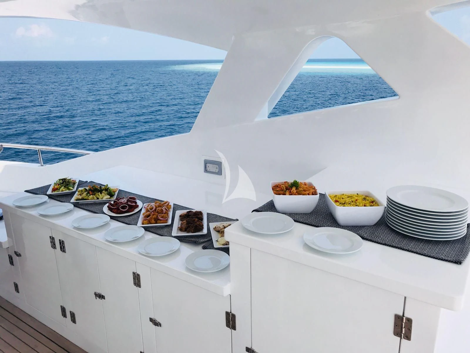 a white kitchen with a view of the ocean aboard SEAREX Yacht for Sale