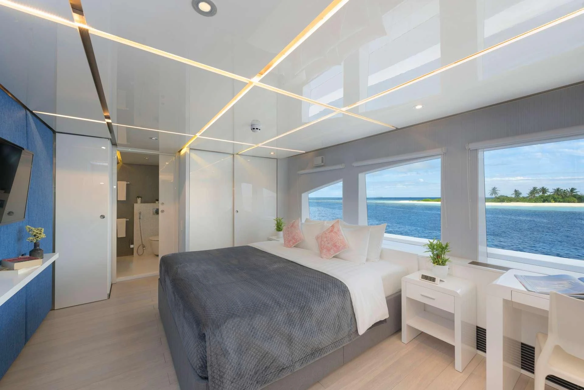a bedroom with a large bed aboard SEAREX Yacht for Sale