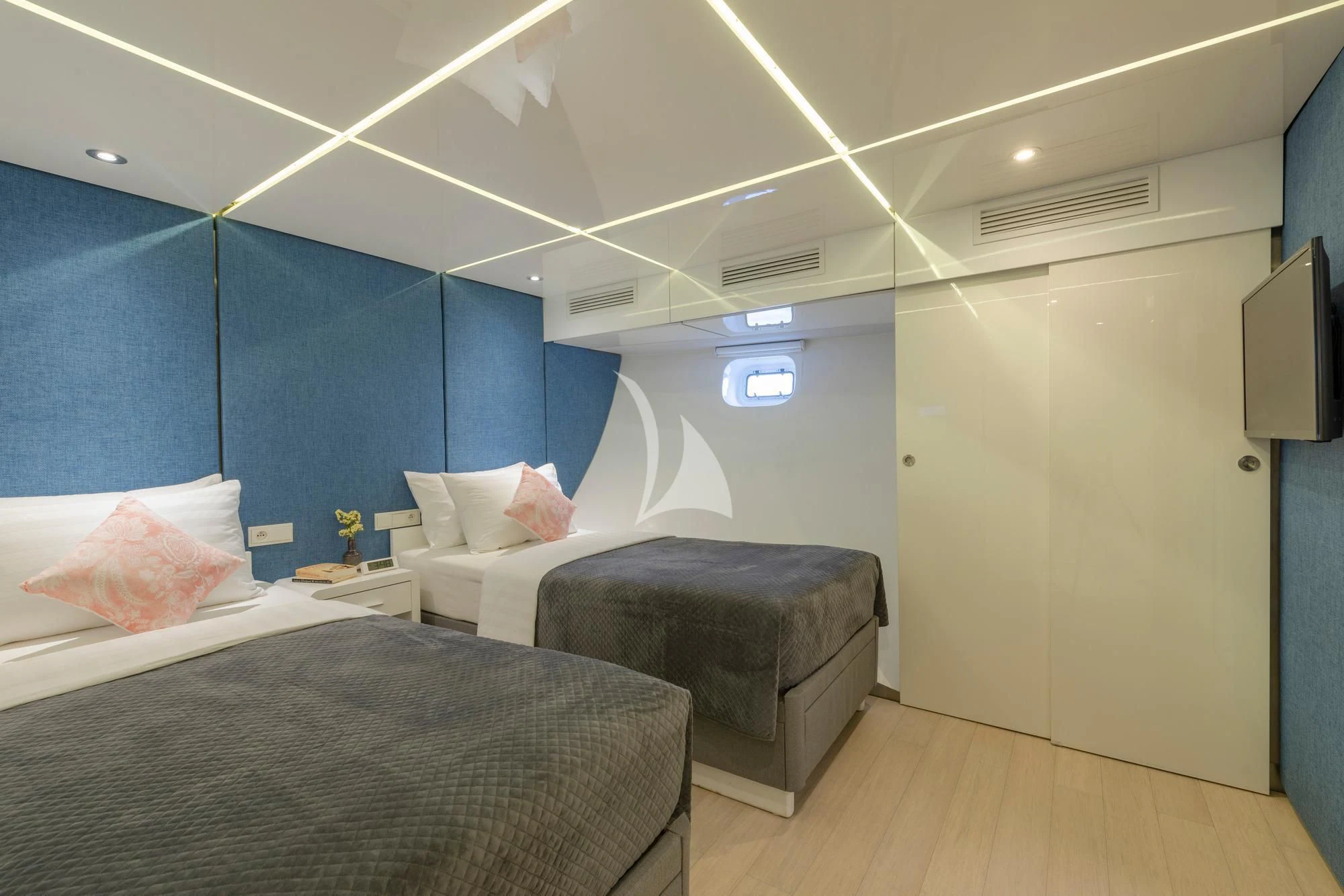 a room with a bed and a tv aboard SEAREX Yacht for Sale