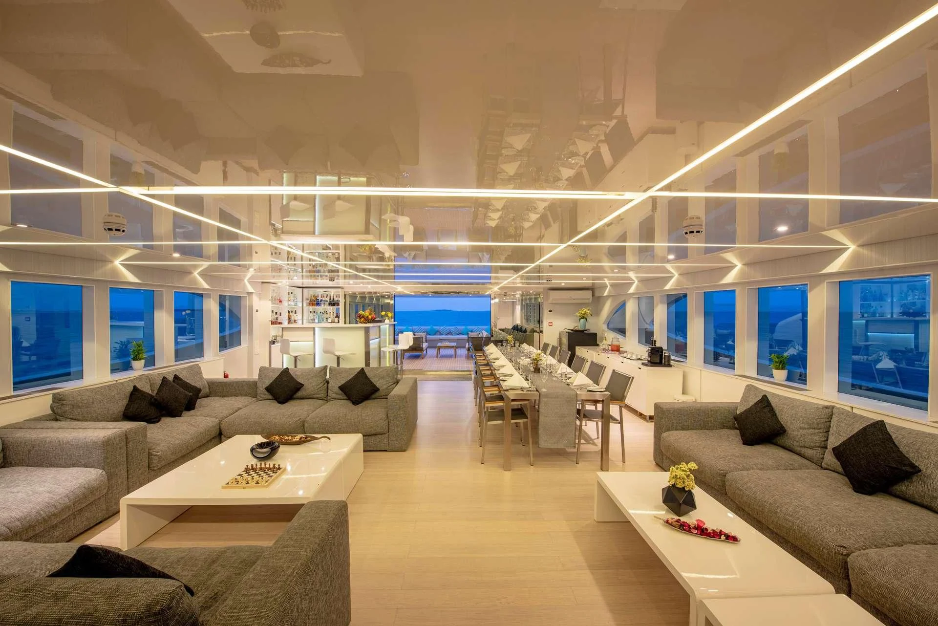 a living room with a couch and a table aboard SEAREX Yacht for Sale