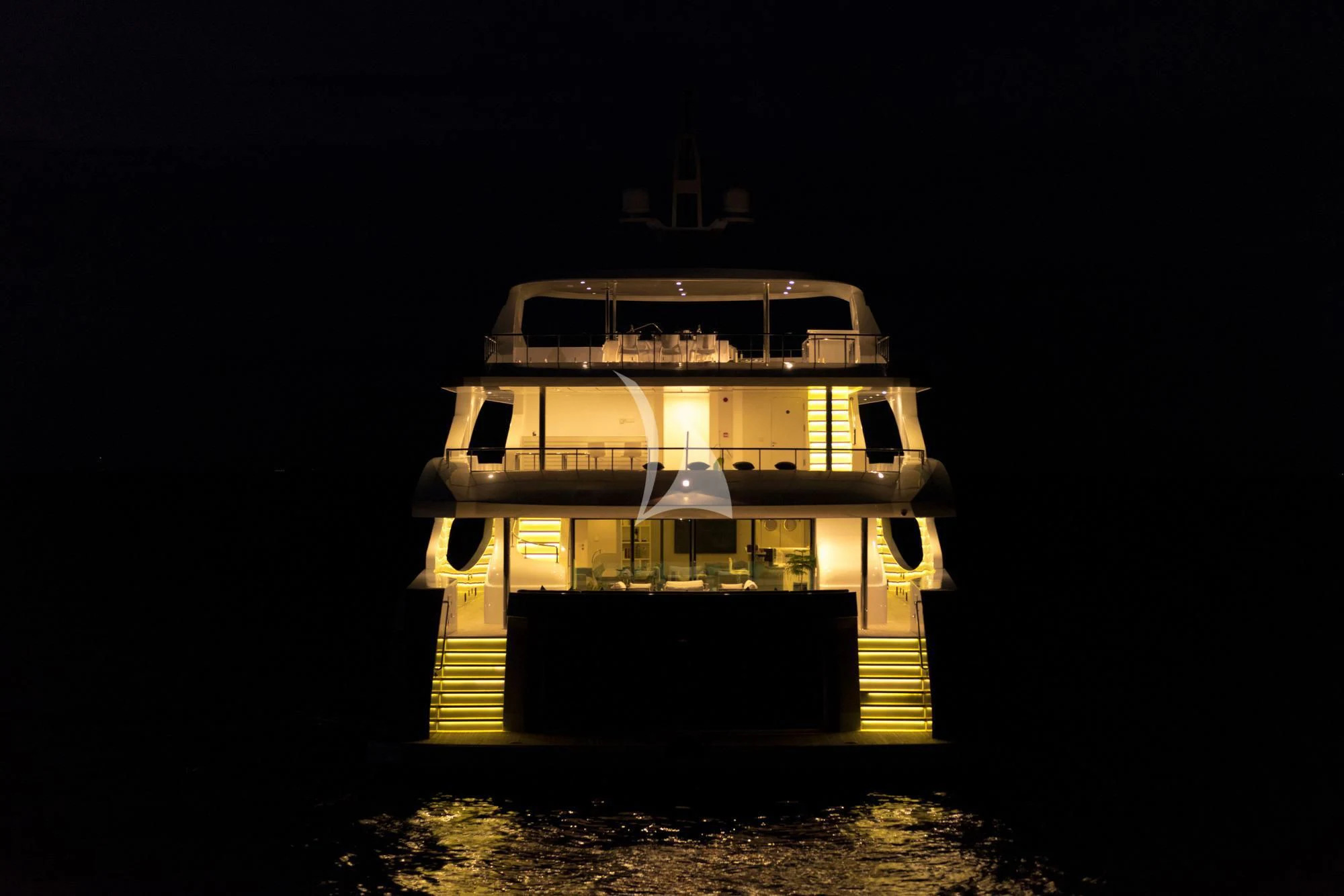 a house with a staircase at night aboard SEAREX Yacht for Sale