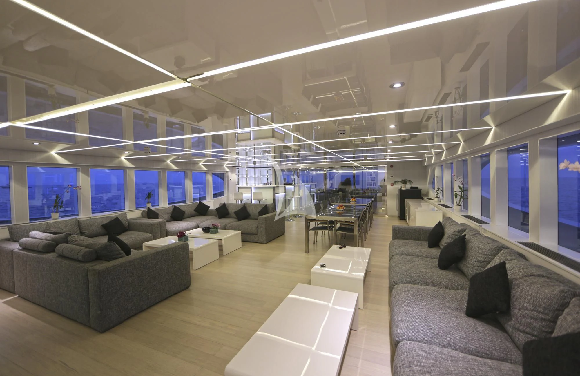 a room with couches and a tv aboard SEAREX Yacht for Sale