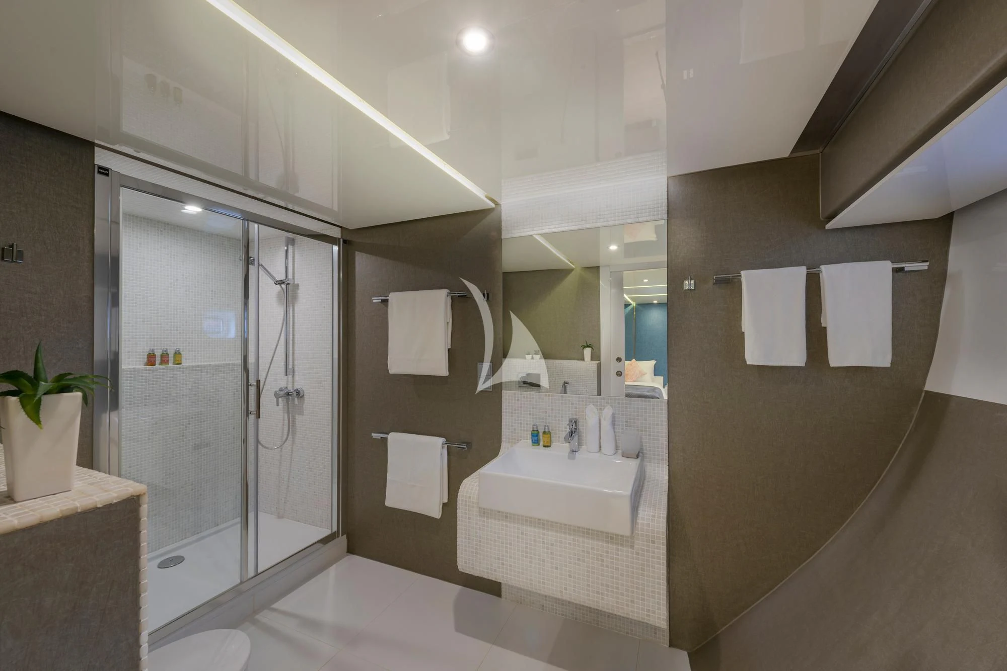 a bathroom with a glass shower aboard SEAREX Yacht for Sale