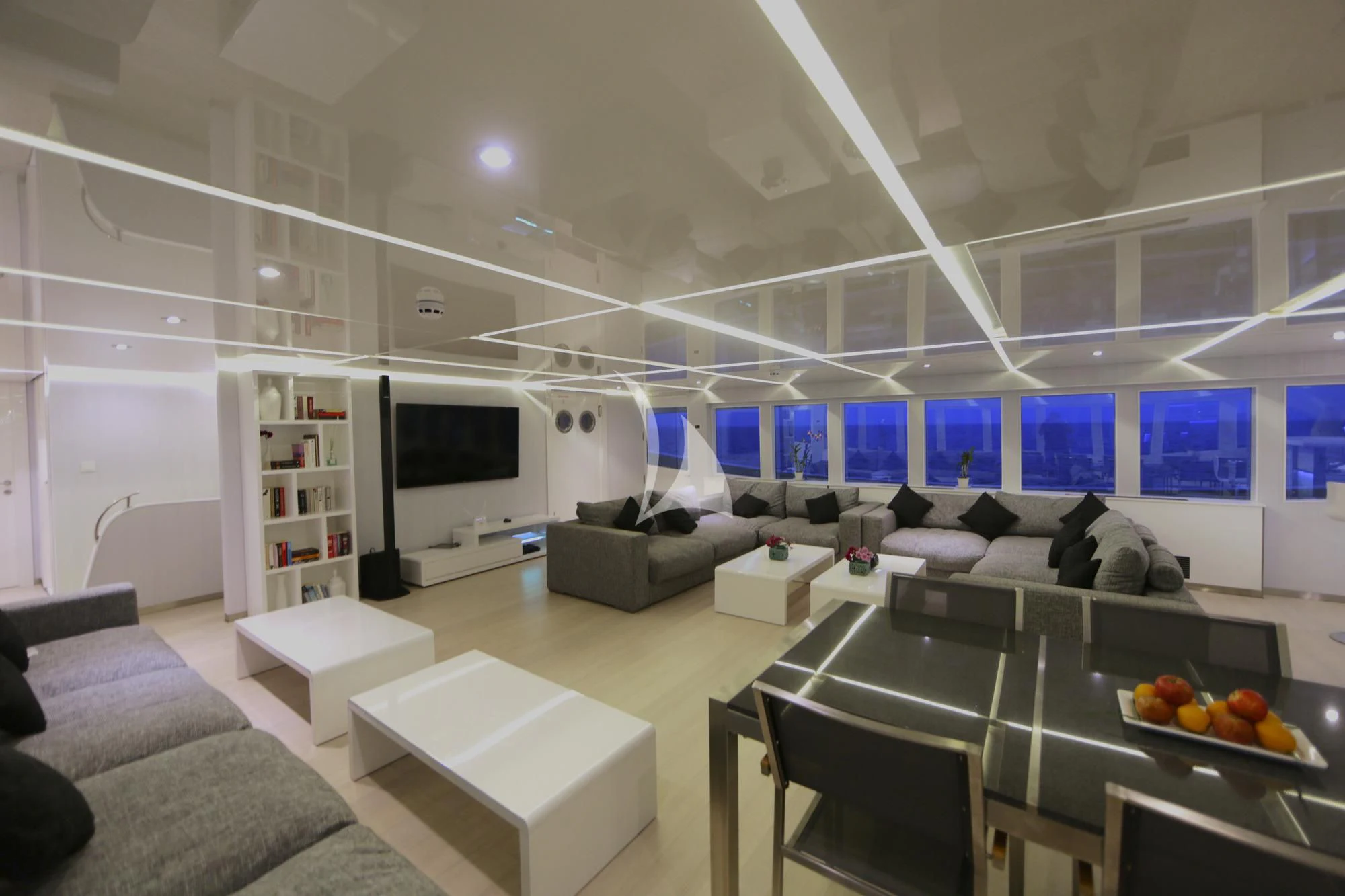 a room with a couch and a tv aboard SEAREX Yacht for Sale