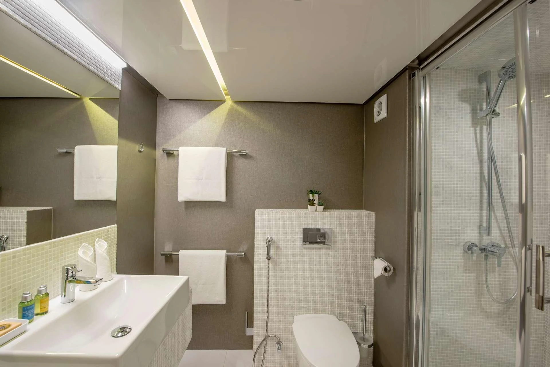 a bathroom with a glass shower aboard SEAREX Yacht for Sale