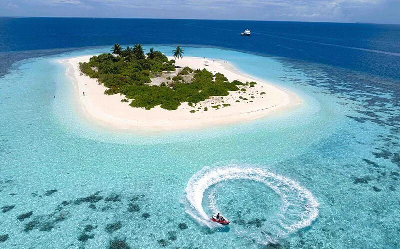 a beach with a small island aboard SEAREX Yacht for Sale