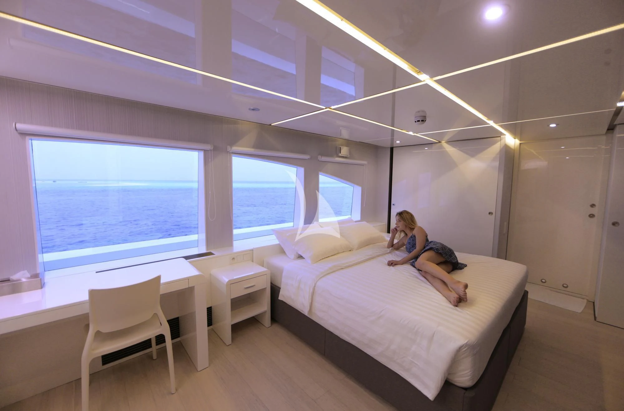 a person sitting on a bed aboard SEAREX Yacht for Sale