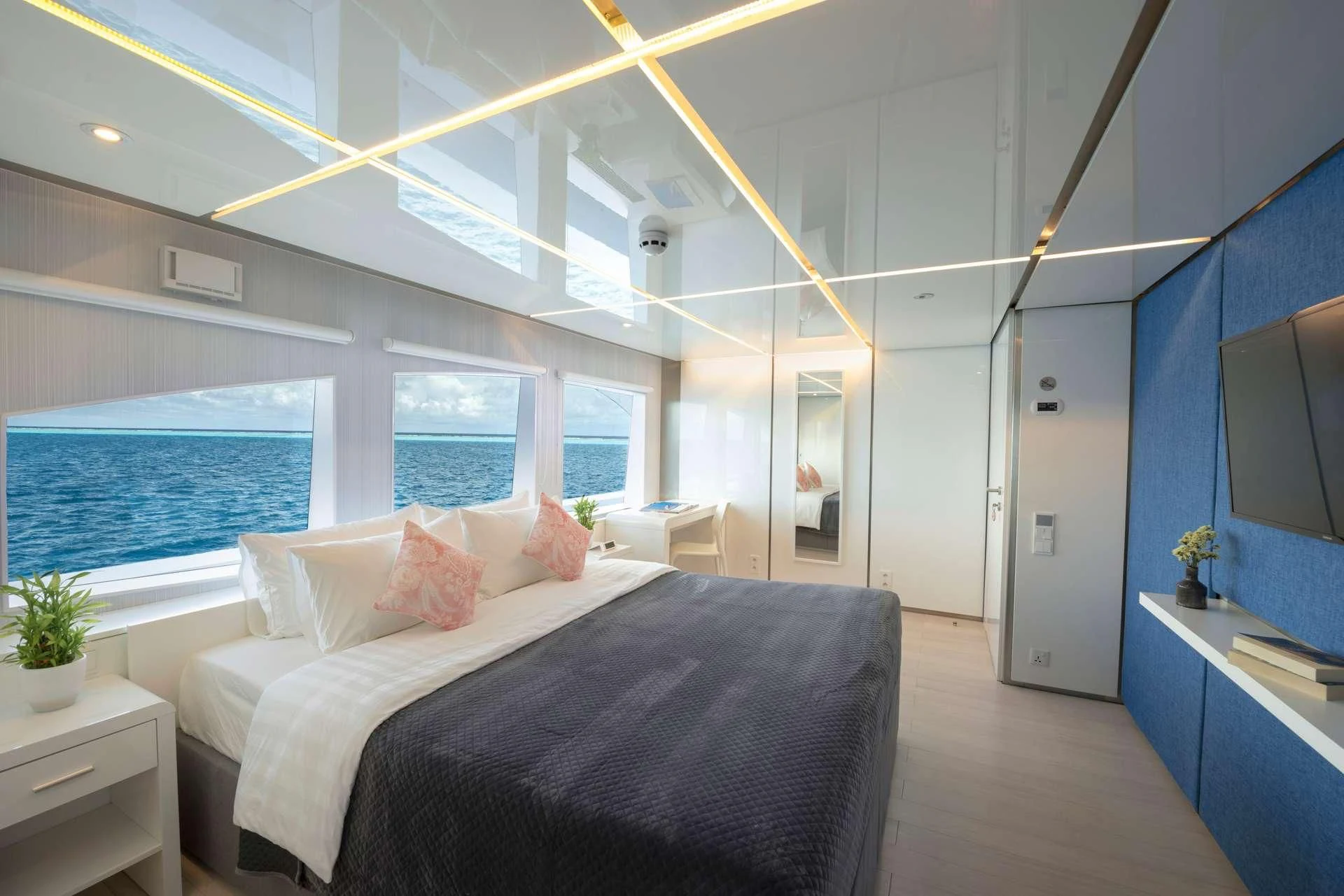 a bedroom with a large bed aboard SEAREX Yacht for Sale